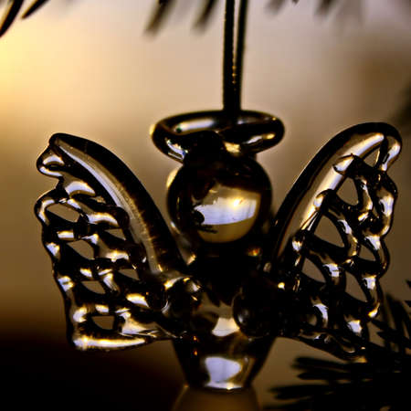 Toy glass angel decoration on the xmas treeの写真素材