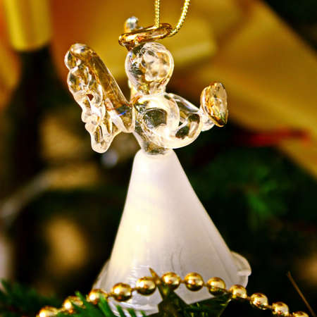 Toy glass angel decoration on the xmas treeの写真素材