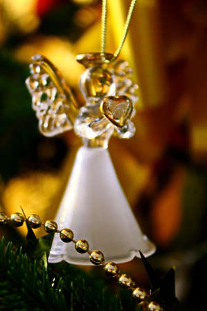 Toy glass angel decoration on the xmas treeの写真素材
