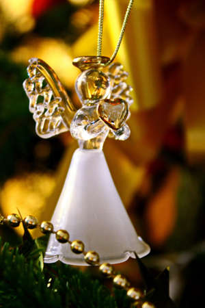 Toy glass angel decoration on the xmas treeの写真素材