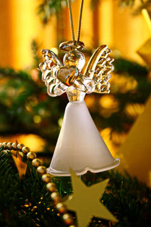 Toy glass angel decoration on the xmas treeの写真素材