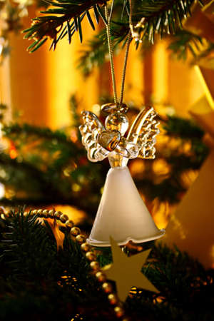 Toy glass angel decoration on the xmas treeの写真素材