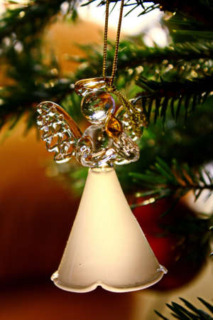 Toy glass angel decoration on the xmas treeの写真素材