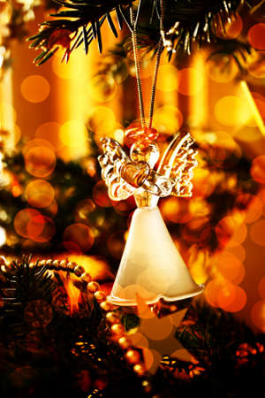 Toy glass angel decoration on the xmas treeの写真素材