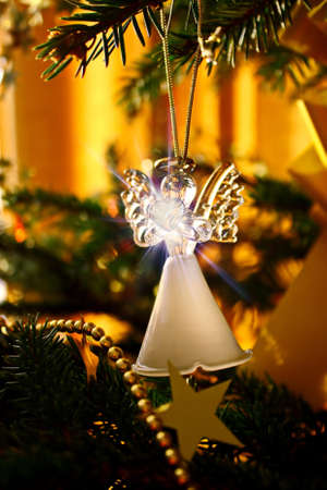 Toy glass angel decoration on the Christmas treeの写真素材