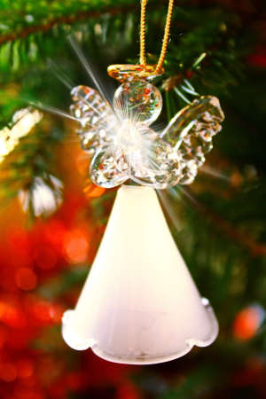 Toy glass angel decoration on the Christmas treeの写真素材