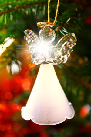 Toy glass angel decoration on the Christmas treeの写真素材