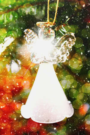 Toy glass angel decoration on the Christmas treeの写真素材