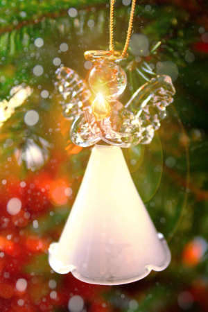 Toy glass angel decoration on the Christmas treeの写真素材