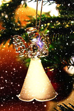 Toy glass angel decoration on the Christmas treeの写真素材