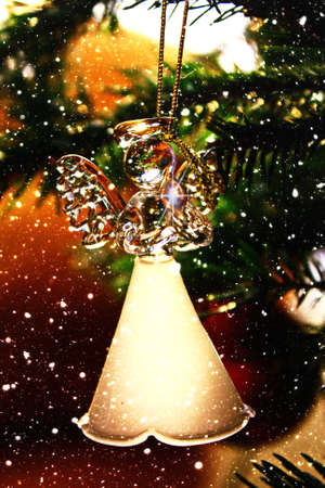 Toy glass angel decoration on the xmas treeの写真素材