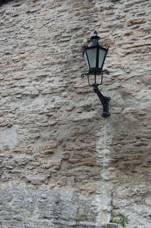 Old wall with lantern, europeの写真素材