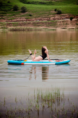 Woman with paddle board, sporty lifestyle.