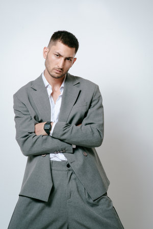 Fashion man model in gray suit, shoot in studioの写真素材