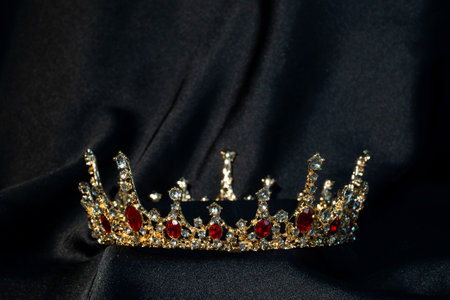 Royal crown for queen nad princess with red gemstones, garnet. Symbol of authority
