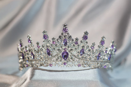 Royal crown with amethyst gemstones, garnets for queen and princessの写真素材