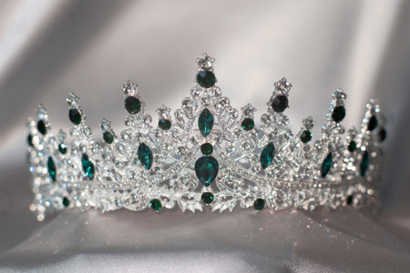 Crown with emerald green gemstones. Jewelryの写真素材