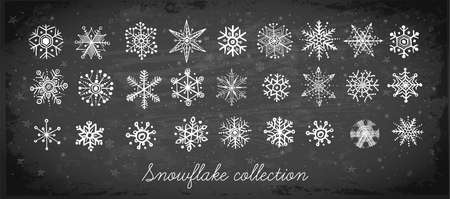 Doodle snowflakes hand drawn with white chalks on blackboard background.のイラスト素材