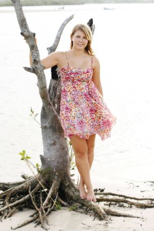 Beautiful young caucasian woman at the beachの写真素材