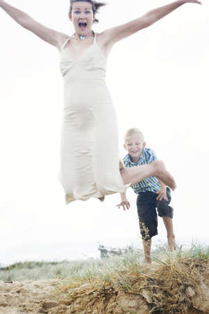Mother and son having fun at the beach.の写真素材