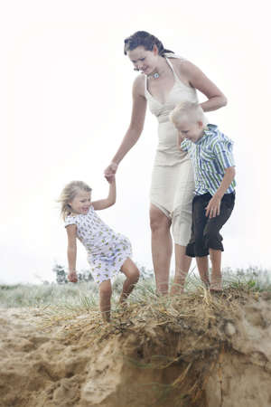 Mother and children at the beach.