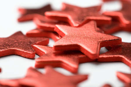 Close-up of shiny red star shape Christmas decorationsの写真素材