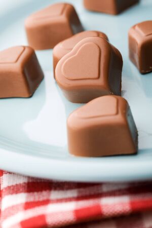 Delicious chocolate hearts on a plateの写真素材