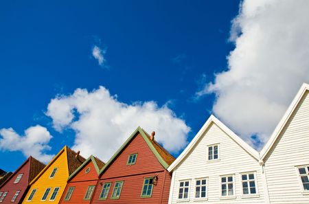 Row of colourful houses and beautiful blue skyの写真素材