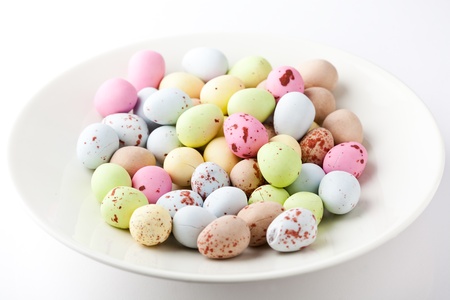 Colorful Easter candy on a white plate