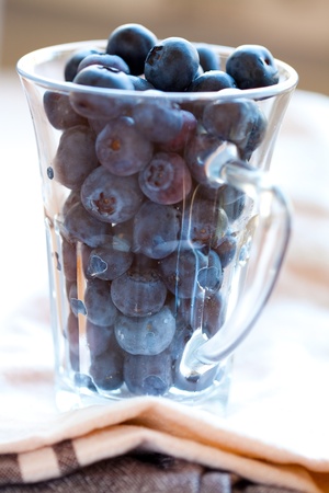 Close-up of delicious blueberries in a glass. Studio shot.の写真素材