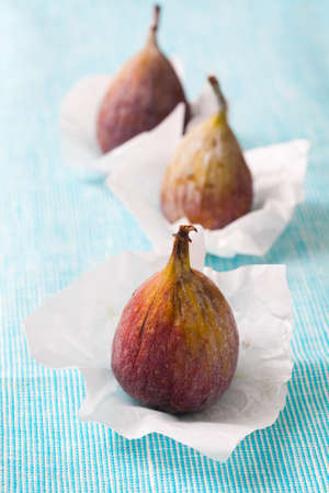 Delicious fresh figs on a blue background. Studio shot.の写真素材