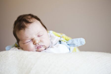 Portrait of a cute newborn baby girl sleeping