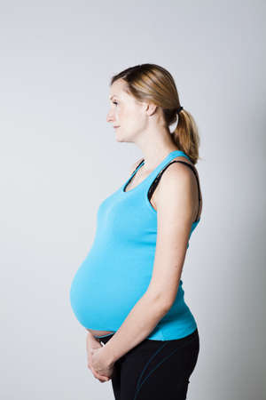 Portrait of a beautiful pregnant woman. Studio shot.の写真素材