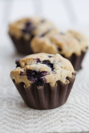 Close-up on delicious and healthy home-made blueberry muffinsの写真素材