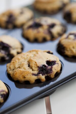 Close-up on delicious and healthy home-made blueberry muffinsの写真素材