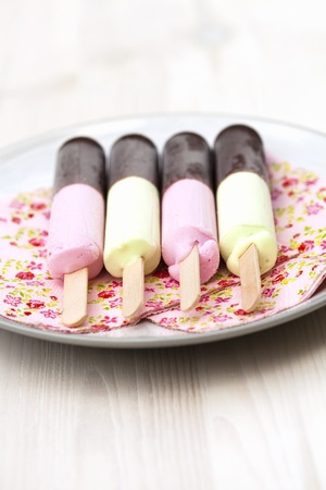 Close-up of delicious ice-cream sticks with chocolate coatingの写真素材