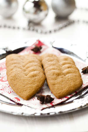 Close-up of delicious heart shape Christmas gingerbread cookies on a plateの写真素材