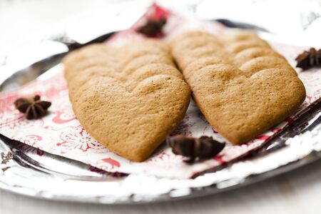 Close-up of delicious heart shape Christmas gingerbread cookies on a plateの写真素材