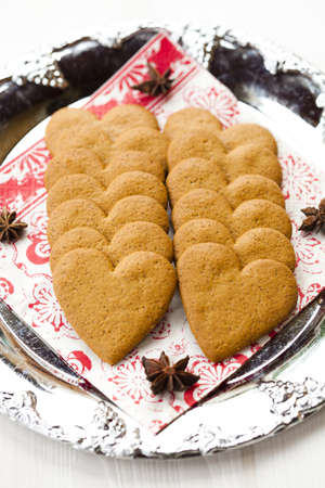 Close-up of delicious heart shape Christmas gingerbread cookies on a plateの写真素材