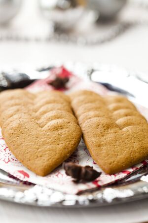 Close-up of delicious heart shape Christmas gingerbread cookies on a plateの写真素材