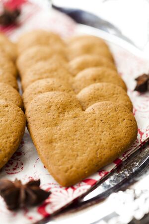 Close-up of delicious heart shape Christmas gingerbread cookies on a plateの写真素材