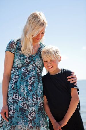 Mother and son on the beach on a beautiful summer dayの写真素材
