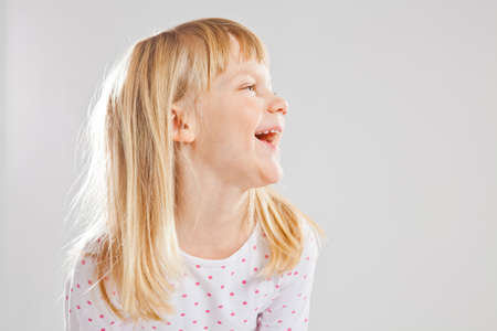 Studio portrait of happy smiling young girl