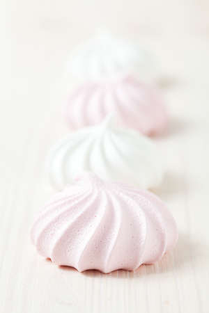 Row of meringues on light backgroundの写真素材