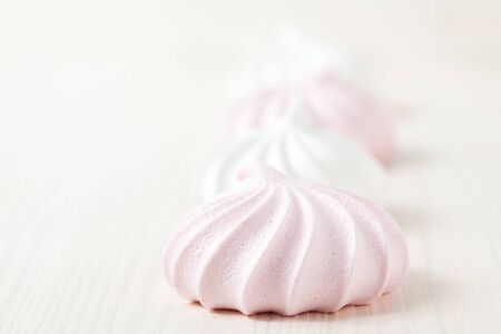 Row of meringues on light backgroundの写真素材