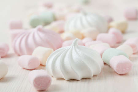 Colorful meringues and marshmallows on light backgroundの写真素材