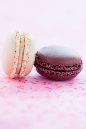 Closeup of two sweet macaroons on pink matの写真素材