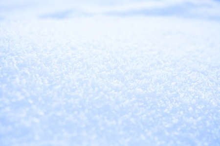 Fresh white powder snow background from outdoors on winter dayの写真素材