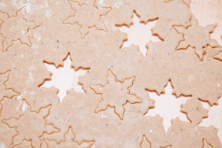 Closeup of gingerbread biscuit dough with star shapesの写真素材