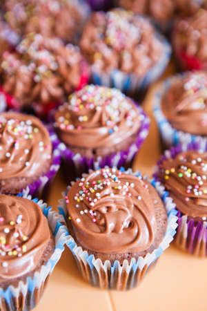 Closeup of chocolate cupcakes with decorative sprinklesの写真素材
